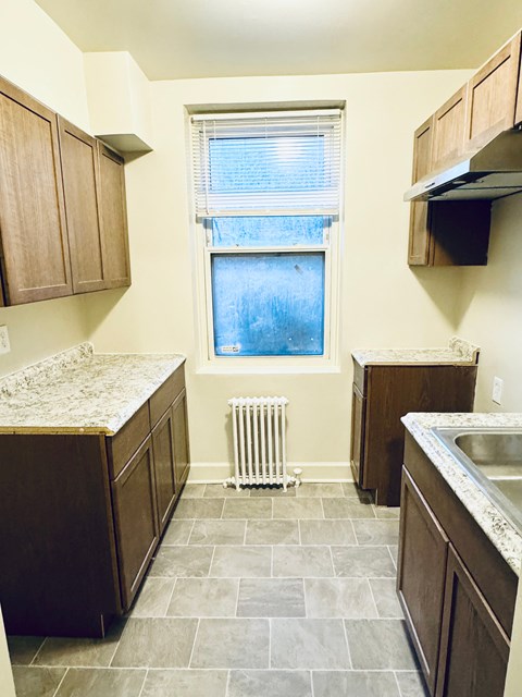 A kitchen with a window and a sink.