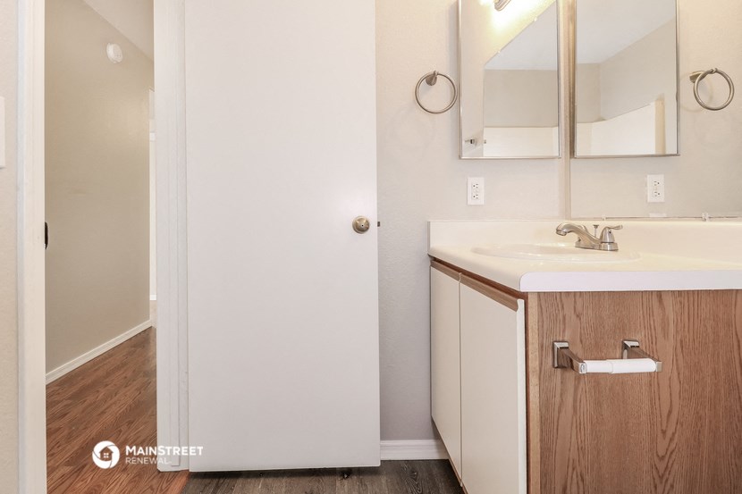 a bathroom with a sink and a mirror