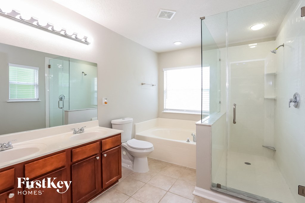 a bathroom with a shower toilet and a sink
