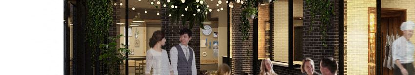 A couple is walking hand in hand in a restaurant.