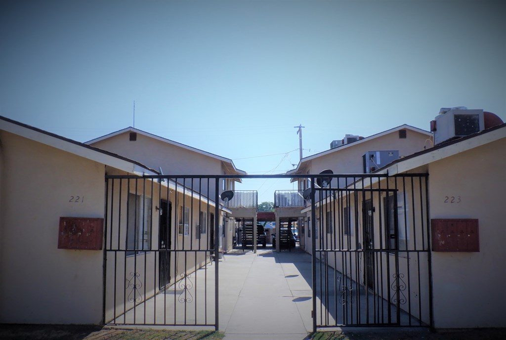 a gate at the entrance to a prison yard