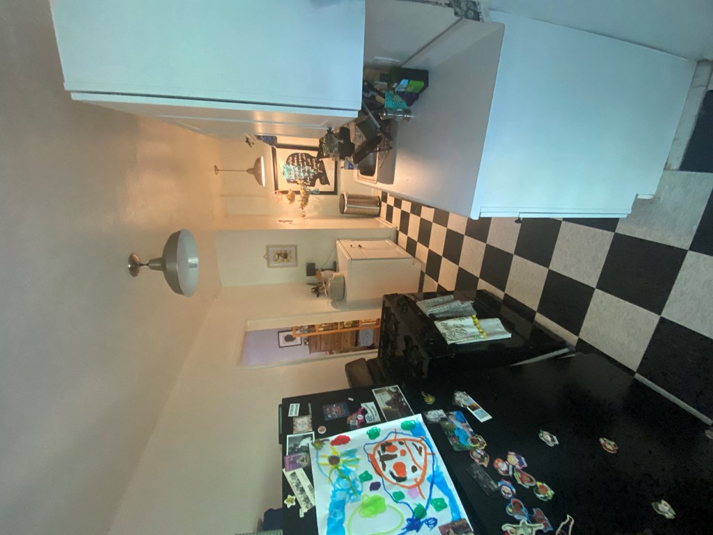 a view of a kitchen from the top of the counter