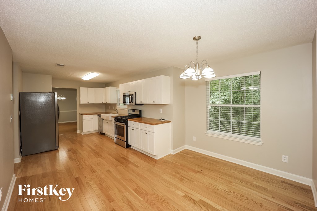 the kitchen and living room of an open floor plan