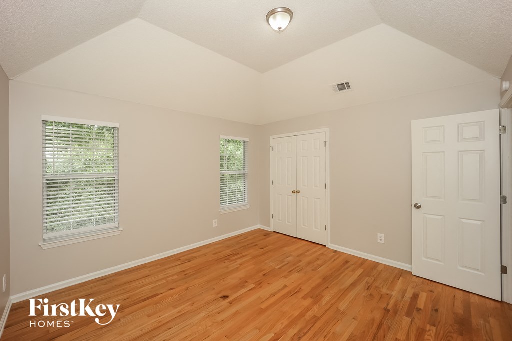 the second bedroom has a hard wood floor and two closets