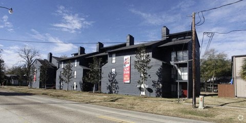 a building with a sign on the side of a street