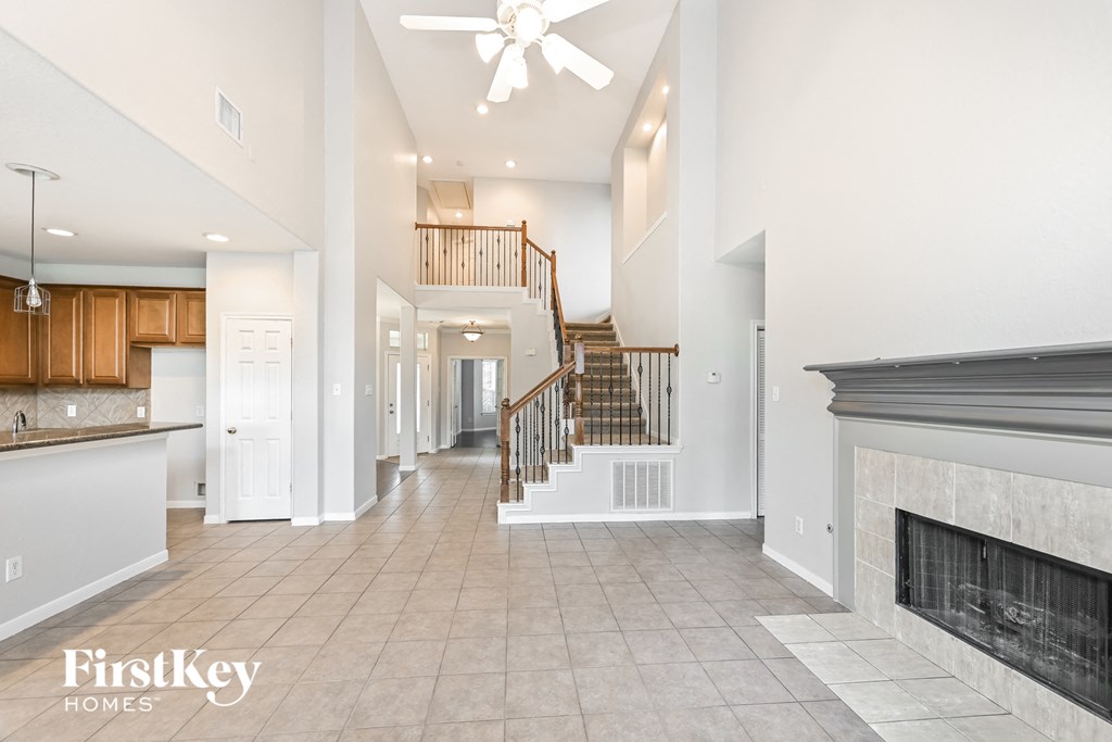 the living room is open to the kitchen and family room