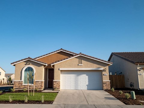 a house with a white garage door in front of it