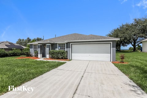 a home with a driveway and a garage door