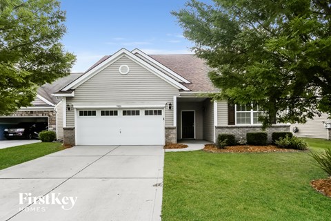 a white house with a white garage door