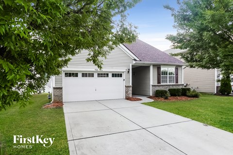 a white house with a white garage door