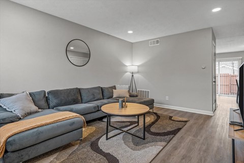 a living room with a couch and a table