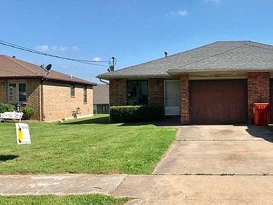 a house with a driveway and a garage door