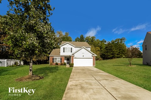 A house with a driveway in front of it.