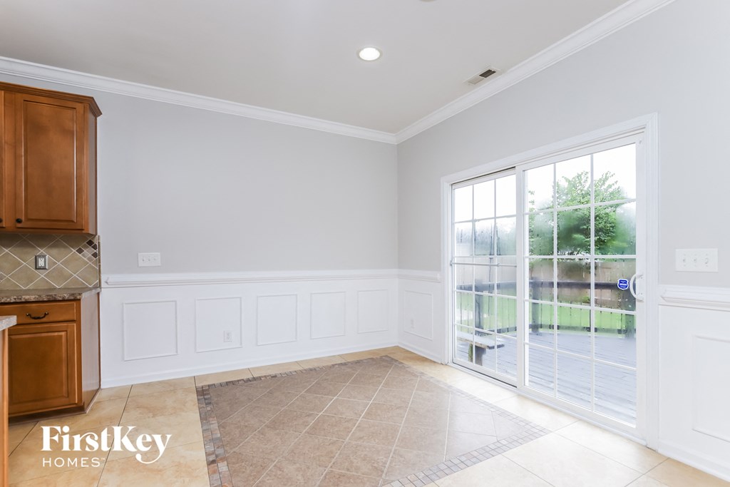 an empty kitchen with a door to a patio