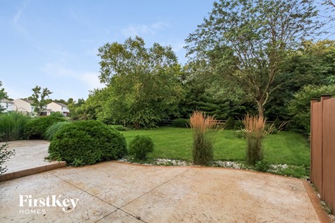 A well-manicured garden with a variety of plants and trees.