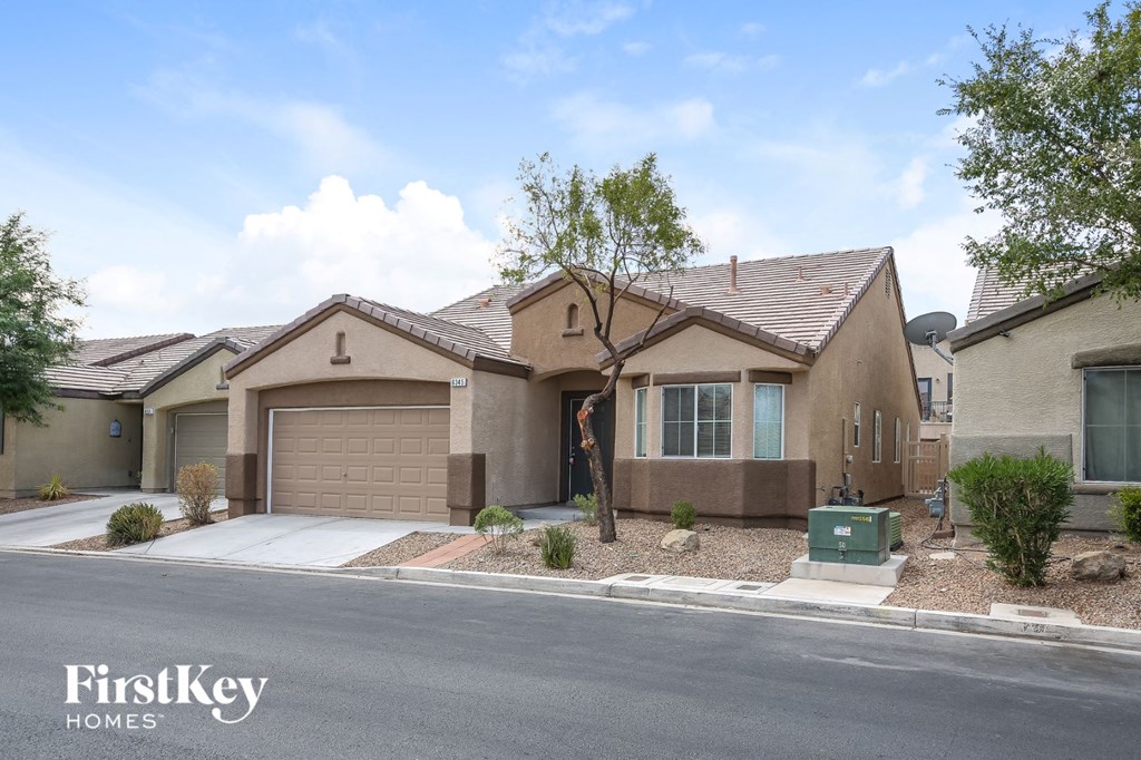 A row of houses with the logo "FirstKey Homes" on the bottom left.