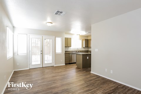 the living room and kitchen of an apartment