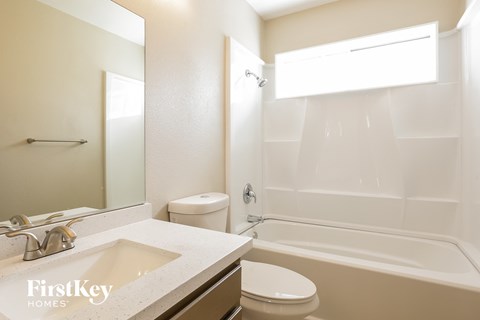 a bathroom with a sink toilet and a shower