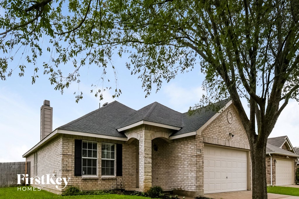 a house with a tree in front of it
