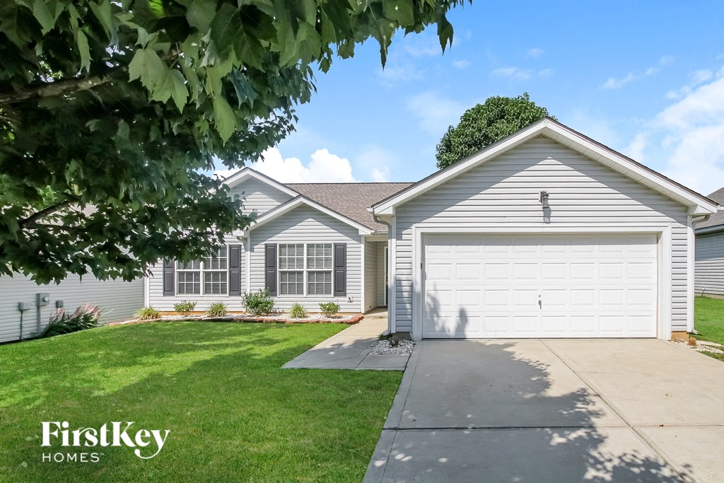 A house with a garage is for sale by FirstKey Homes.