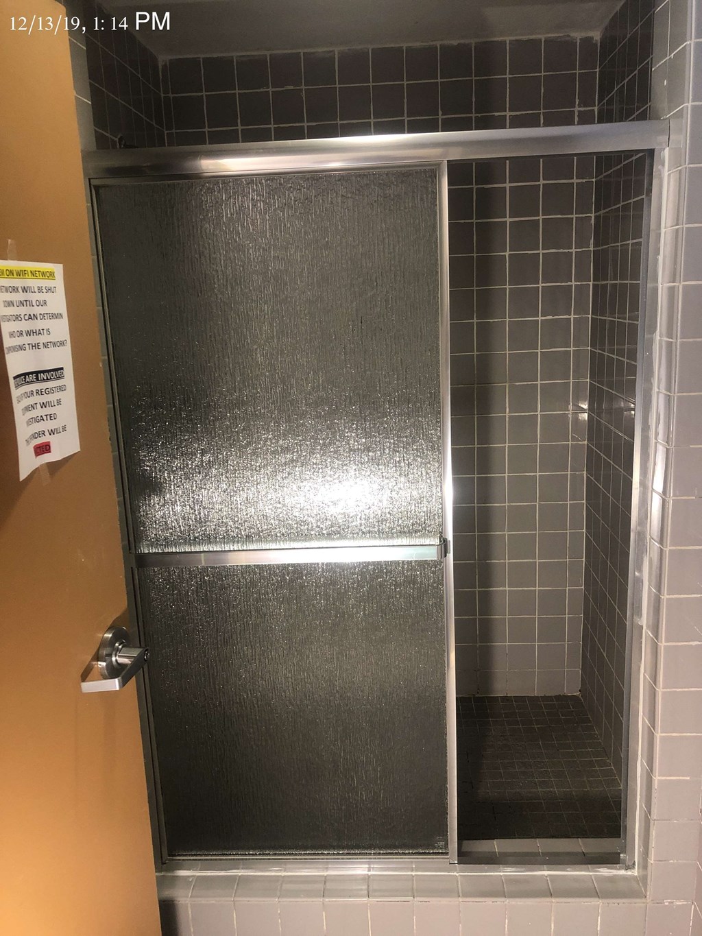 a small shower in a stall in a bathroom