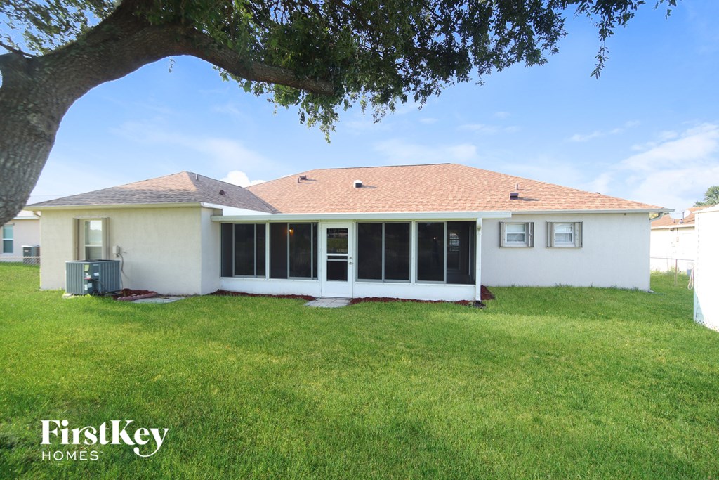 a view of the back of the house from the backyard