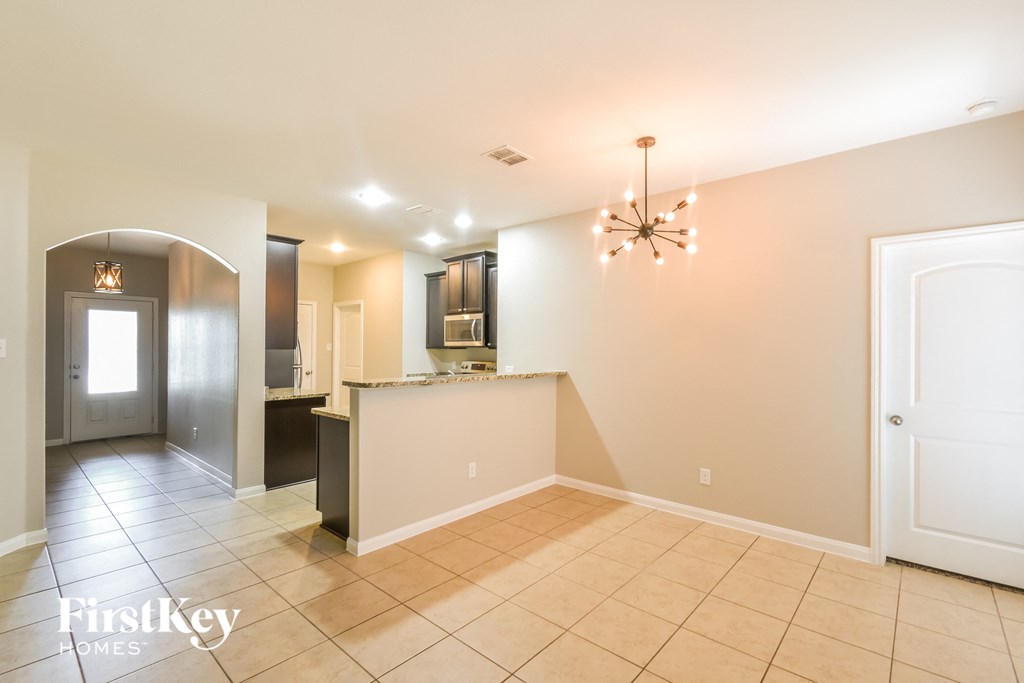 the kitchen and dining room are open to the hallway and living room