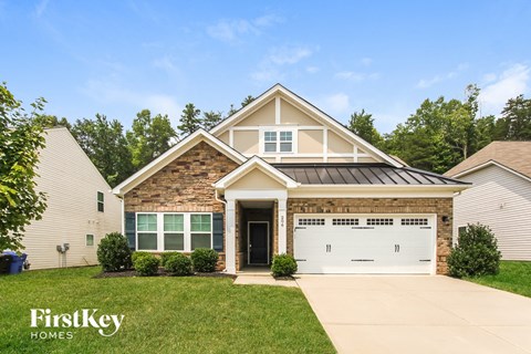 A house with a garage door that has the number 11 on it.