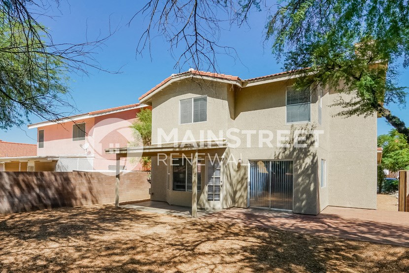 a house with a driveway and a gate