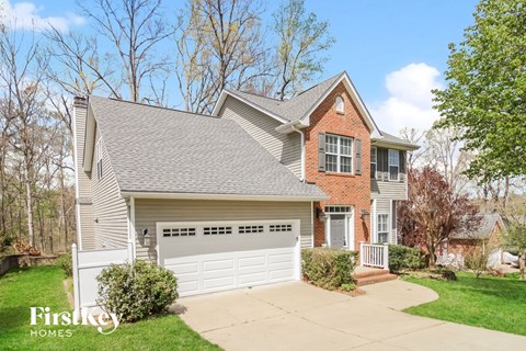 a home with a white garage door