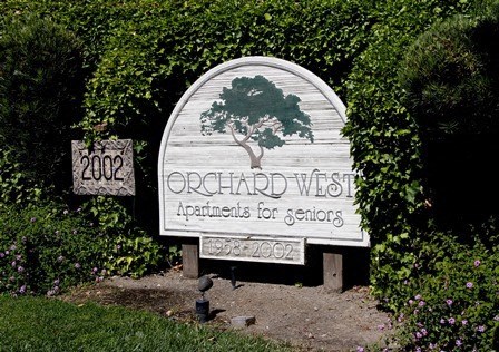 a sign for the apartments for seniors