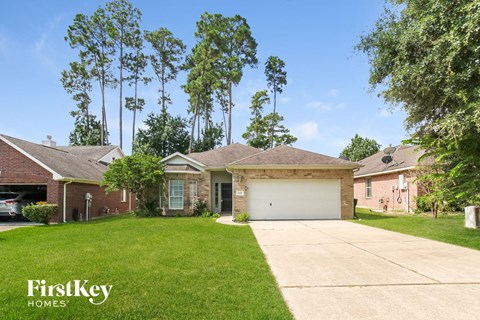 a home with a driveway and a garage door