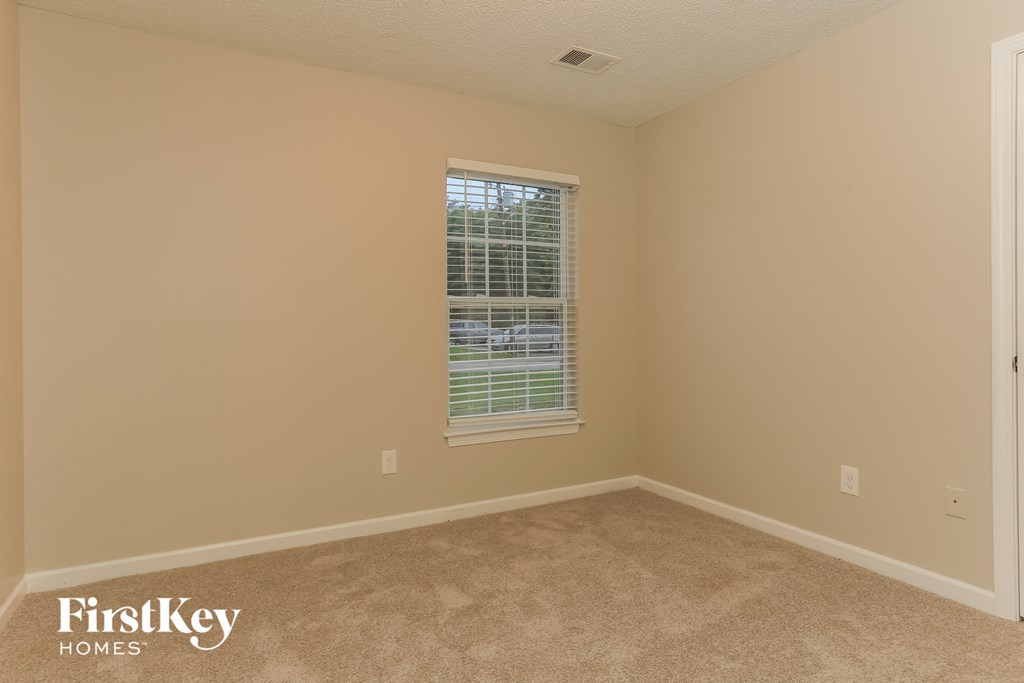 a empty room with a window in it