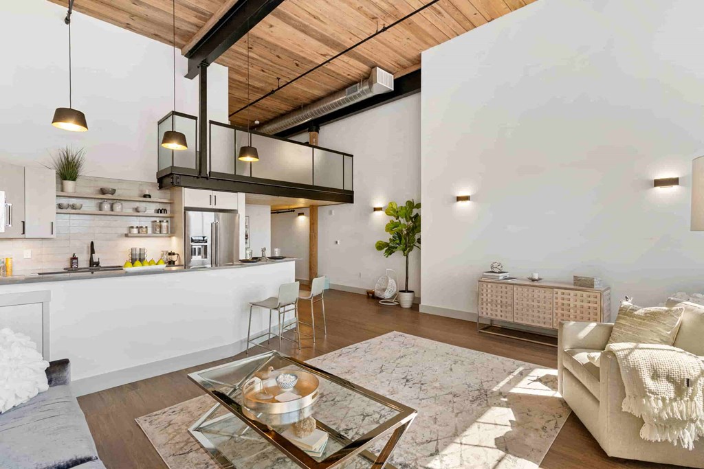 a living room with a couch and a glass table