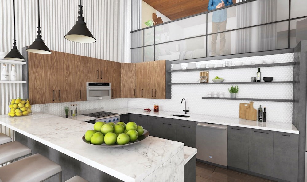 a kitchen with a marble counter top and a bowl of fruit