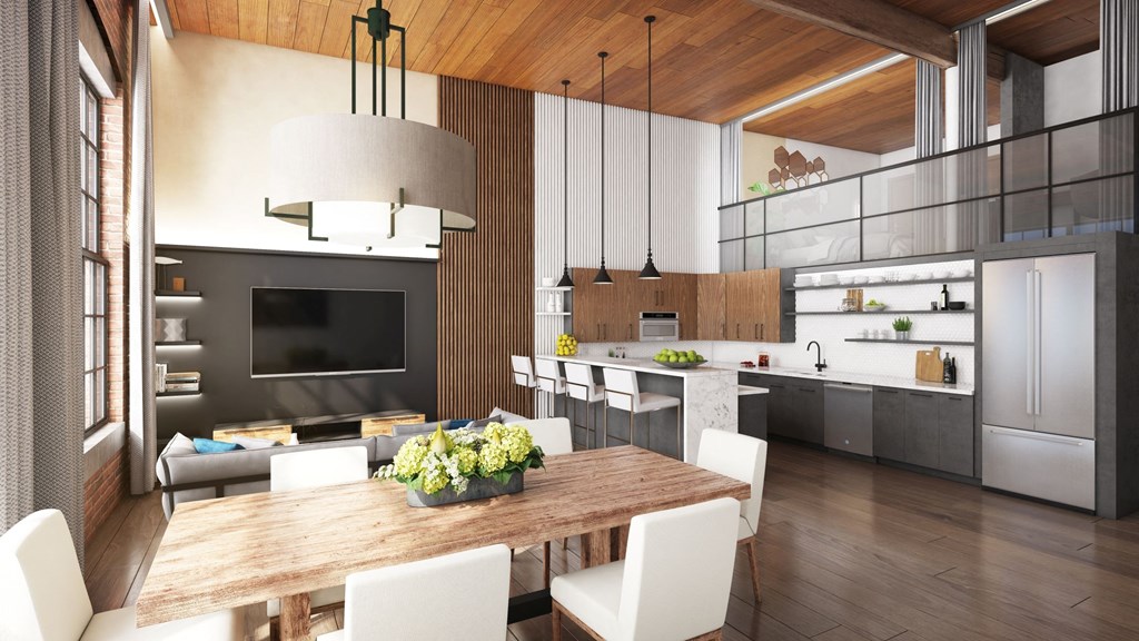 a kitchen and dining room with a table and chairs