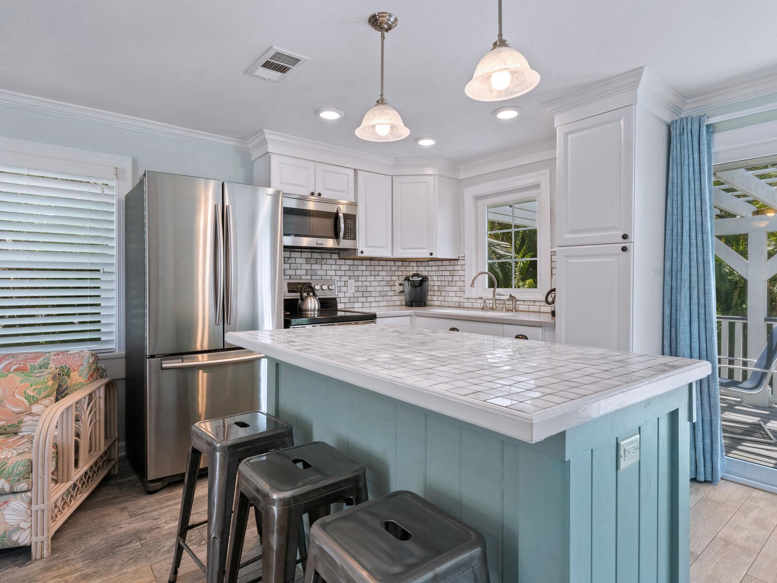 a blue and white kitchen with a counter top