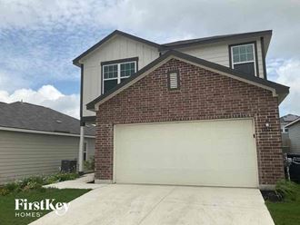 a white garage door in front of a house