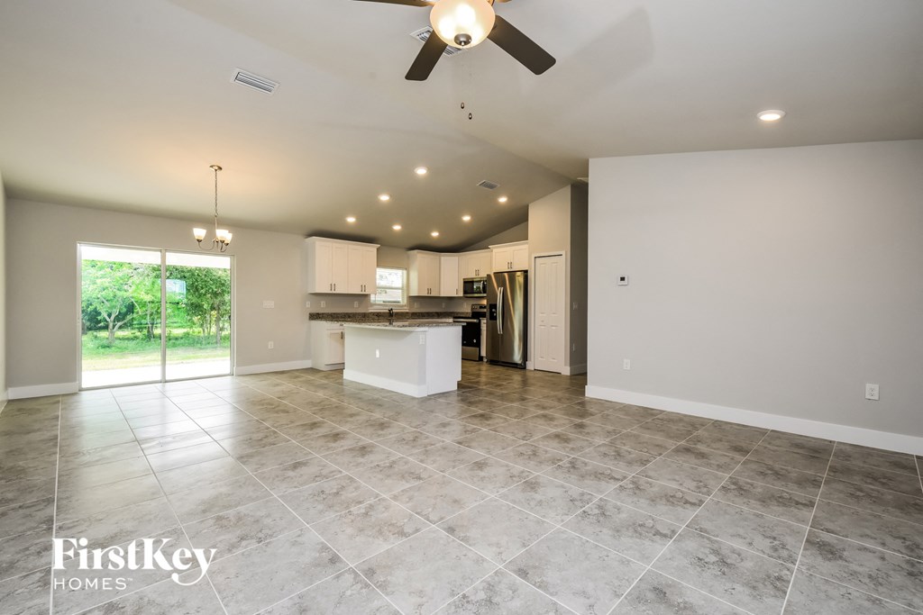 the kitchen is open to the living room and dining room