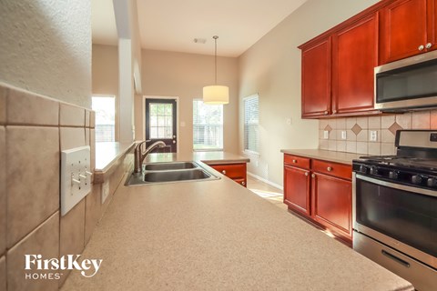 a kitchen with a large counter top and a sink