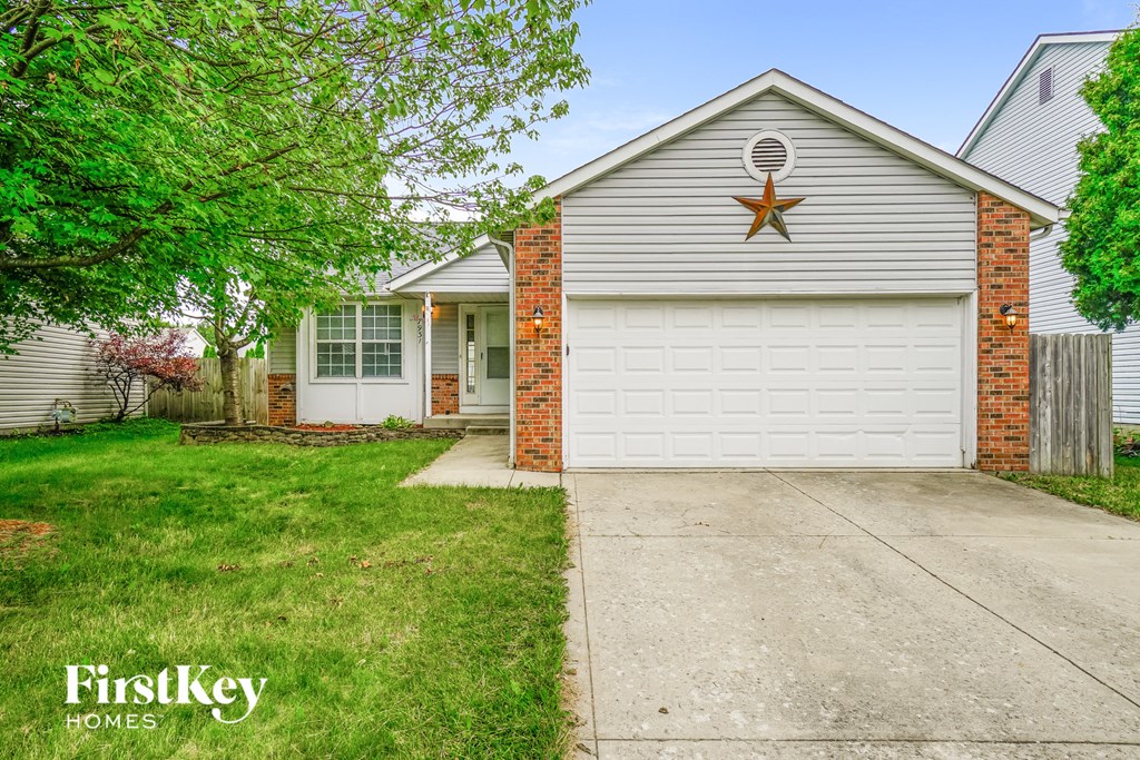a white house with a white garage door