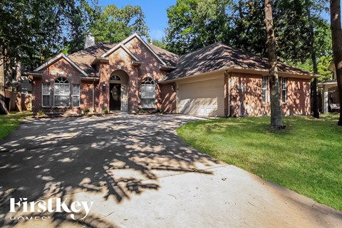 A house with a driveway in front of it.