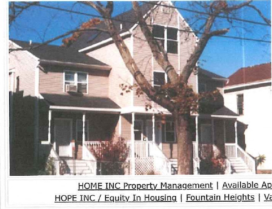 a picture of a house with a tree in front of it