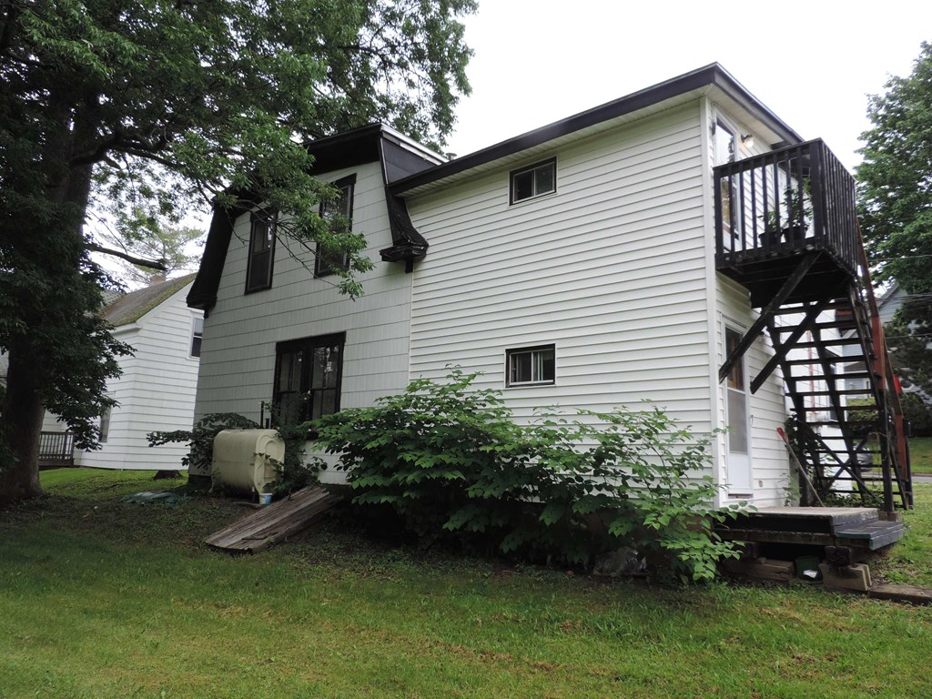 the back of the house with the deck removed