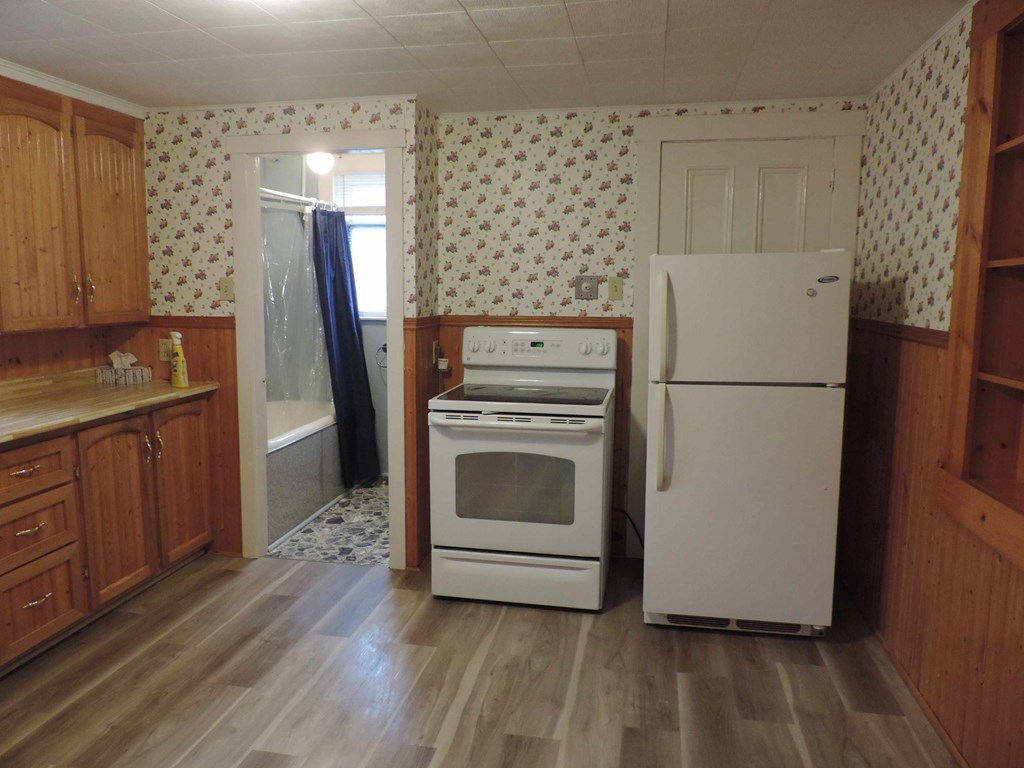 a kitchen with a stove and a refrigerator