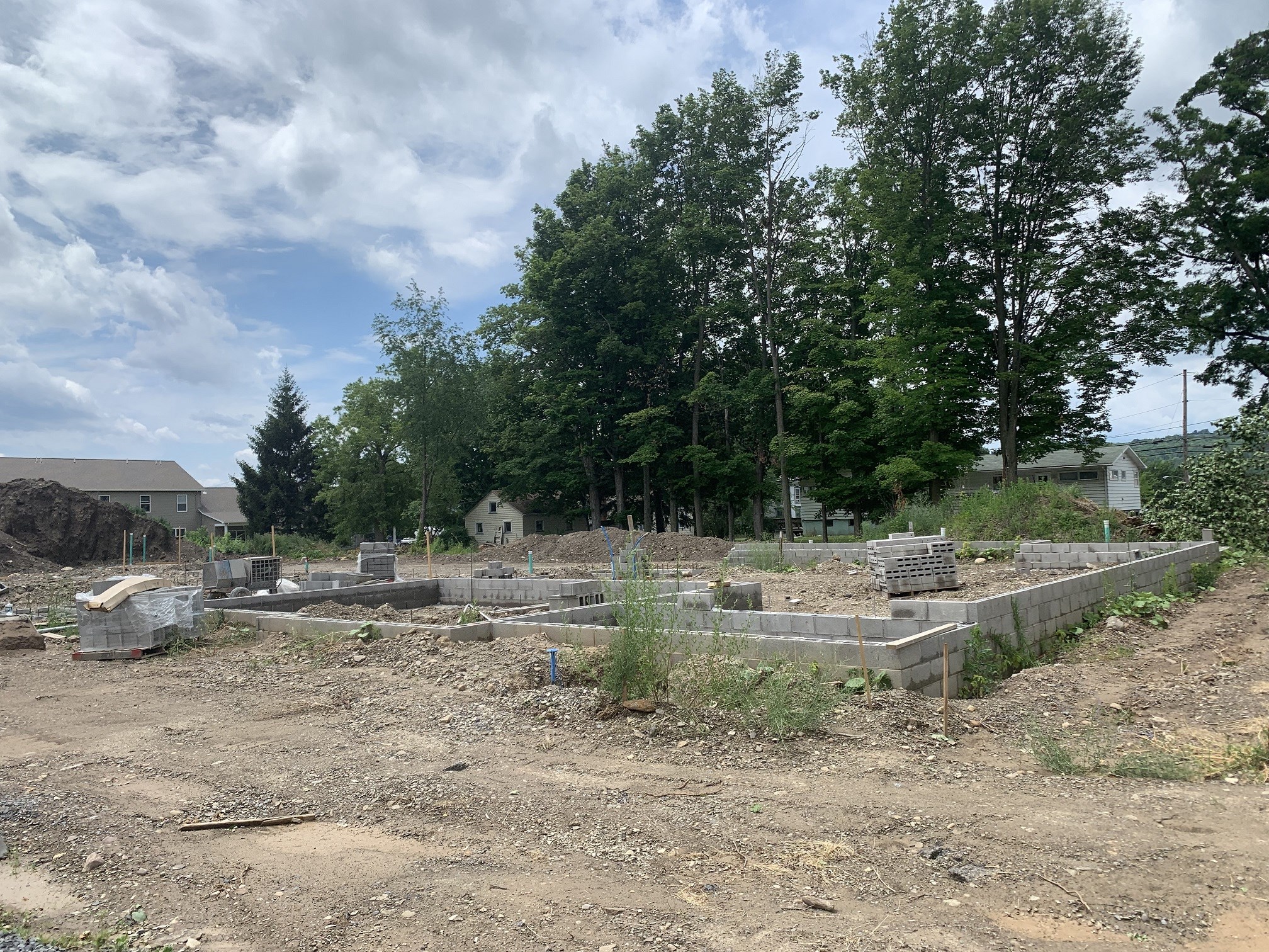 the garden is in the process of being filled with dirt and plants