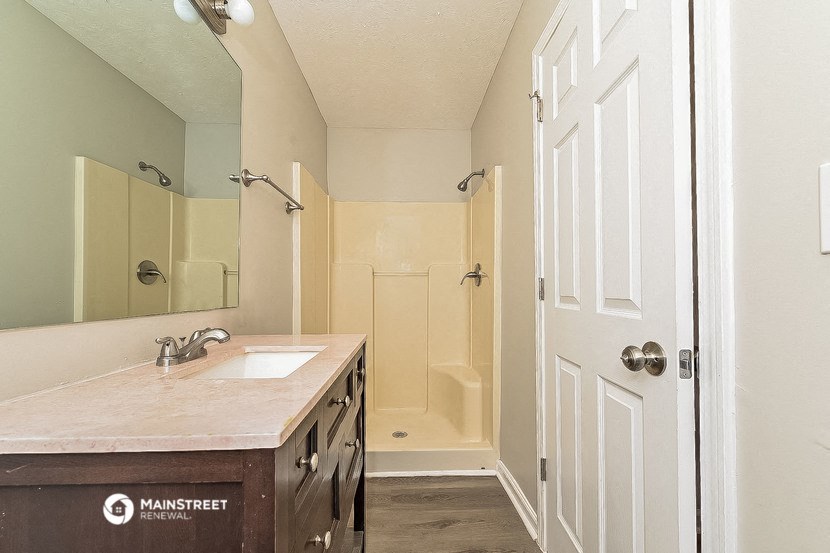 a bathroom with a sink and a shower