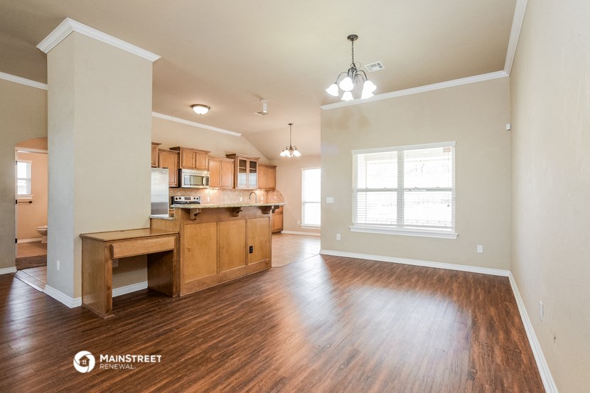 the kitchen and living room of an open floor plan