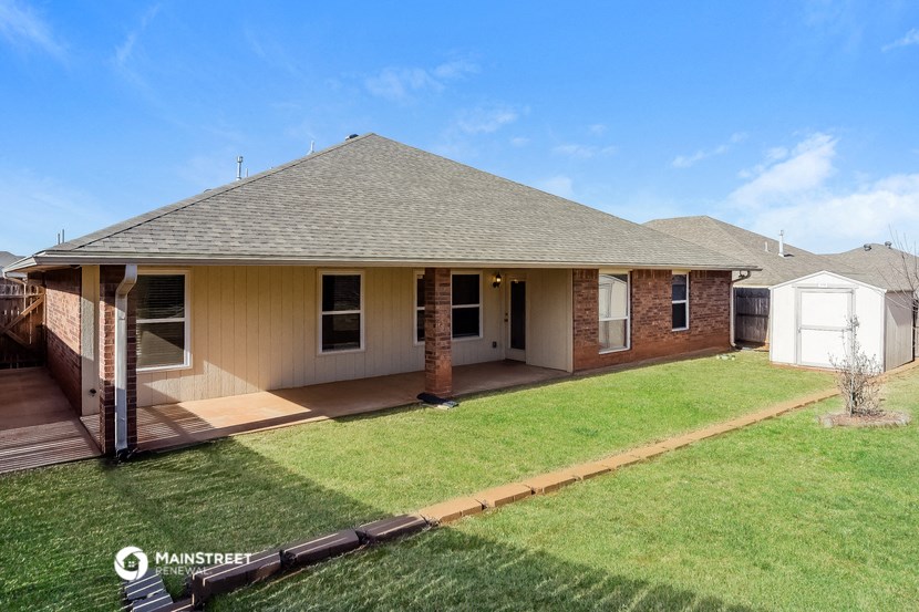 a home with a lawn and a porch