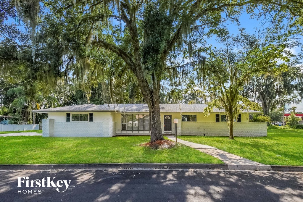 A house with a tree in front of it.